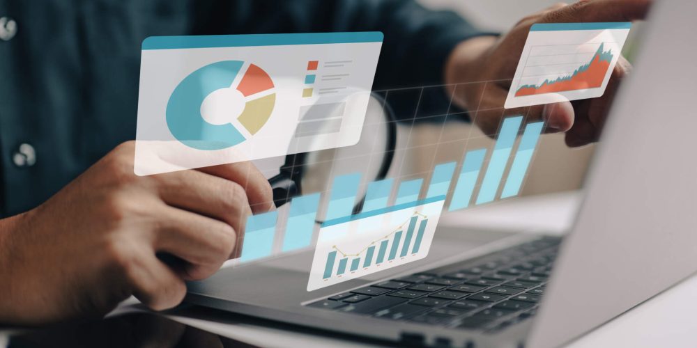 Businesspeople-working-on-a-monitor-graph-dashboard-while-performing-statistical-and-data-analysis-for-corporate-finance-and-investment-ideas.-1413872236_6000x4000